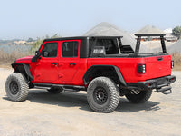 Rear view of pickup truck with installed bed rack in outdoor setting