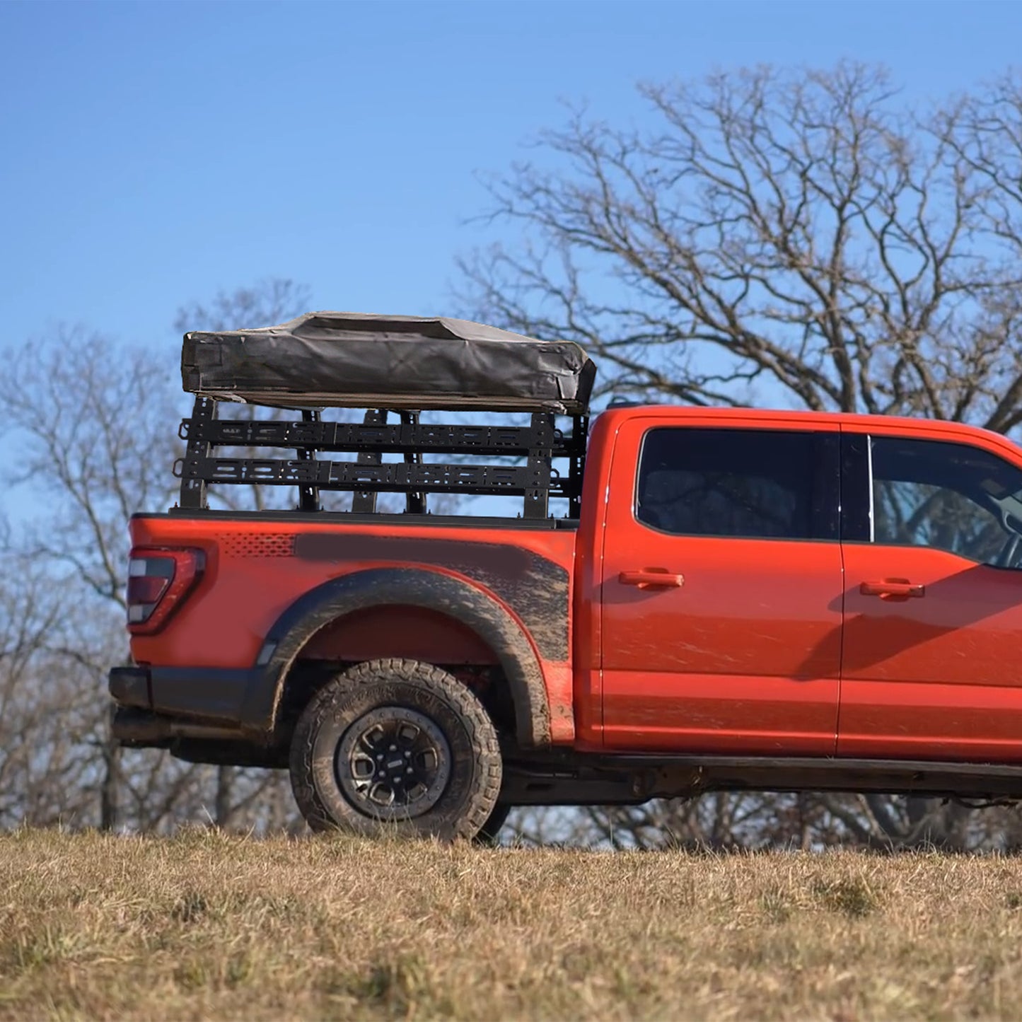 Truck bed rack installed on truck outdoors ready for camping and overland gear.