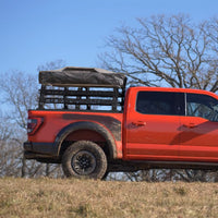 Truck bed rack installed on truck outdoors ready for camping and overland gear.