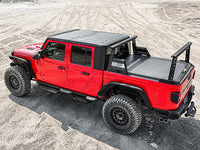 Pickup truck with installed bed rack in an outdoor setting